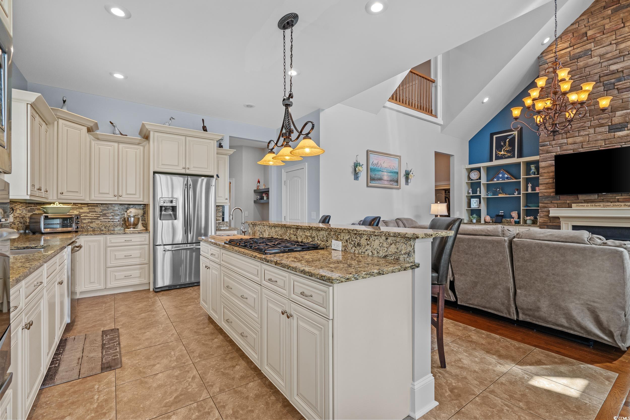 416 Seabury Lane Myrtle Beach, SC 29579 - Photo 12 of 39 Kitchen with light tile patterned floors, a sink, appliances with stainless steel finishes, and a wealth of natural light