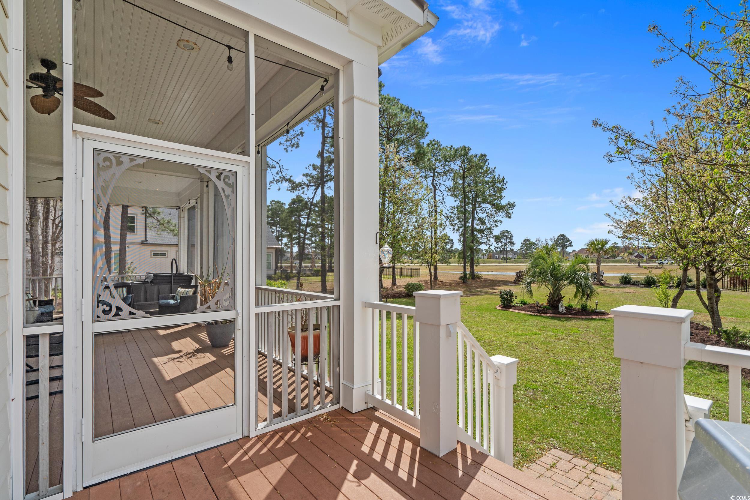 416 Seabury Lane Myrtle Beach, SC 29579 - Photo 13 of 39 Sunroom with outdoor dining space, a ceiling fan, and plenty of natural light