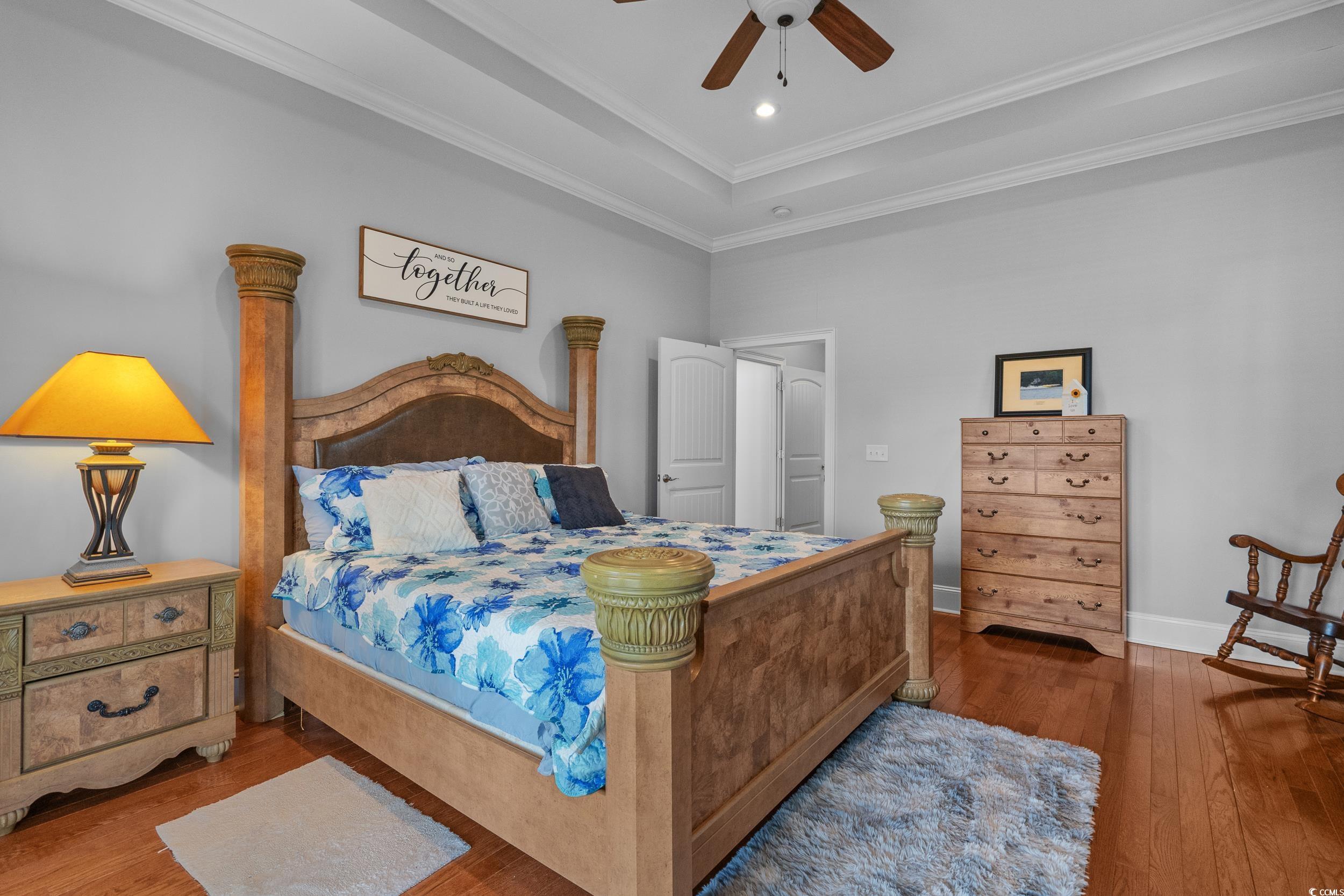 416 Seabury Lane Myrtle Beach, SC 29579 - Photo 18 of 39 Bedroom with access to outside, french doors, wood finished floors, and a raised ceiling