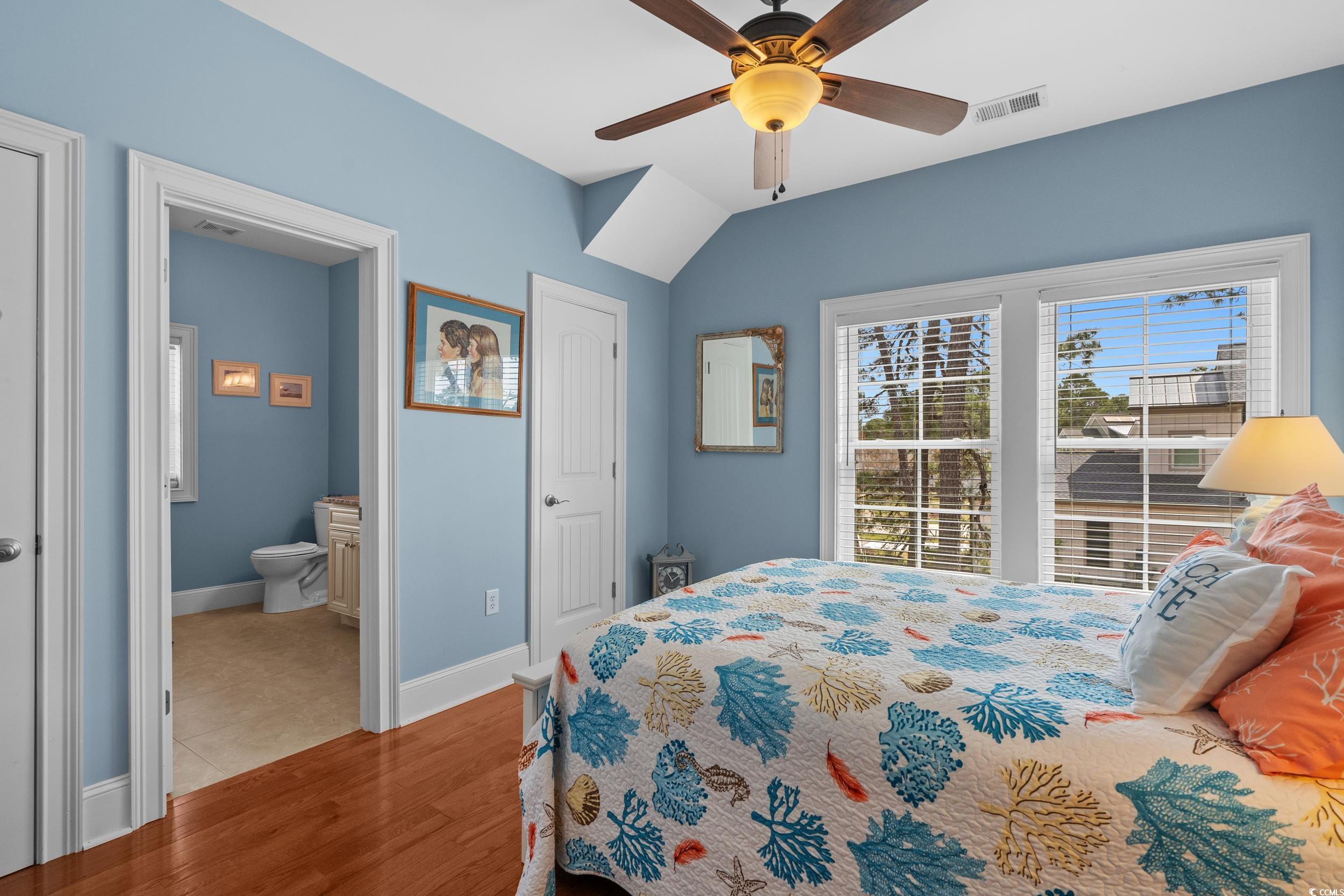 416 Seabury Lane Myrtle Beach, SC 29579 - Photo 22 of 39 Hallway with baseboards, lofted ceiling, an upstairs landing, and hardwood / wood-style flooring