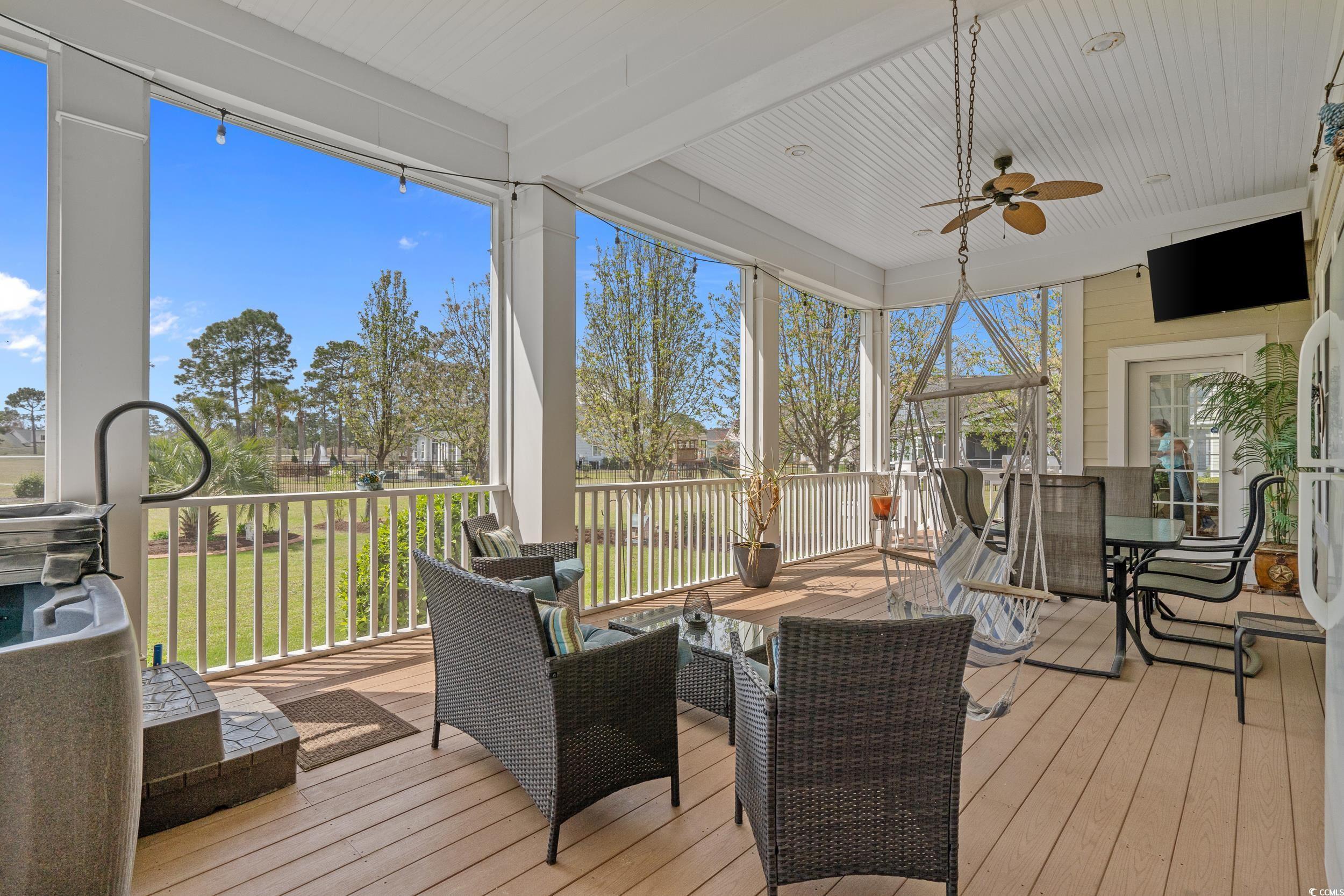 416 Seabury Lane Myrtle Beach, SC 29579 - Photo 4 of 39 Sunroom featuring outdoor dining area and a ceiling fan