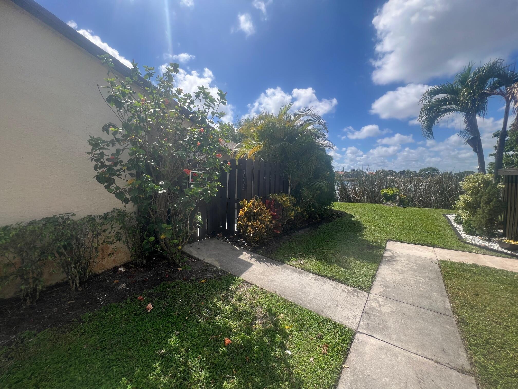 a view of a garden with a pathway