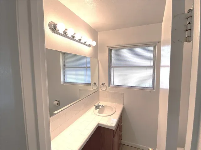 a bathroom with a sink and a bathtub