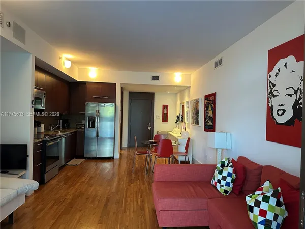 a living room with furniture fireplace and flat screen tv