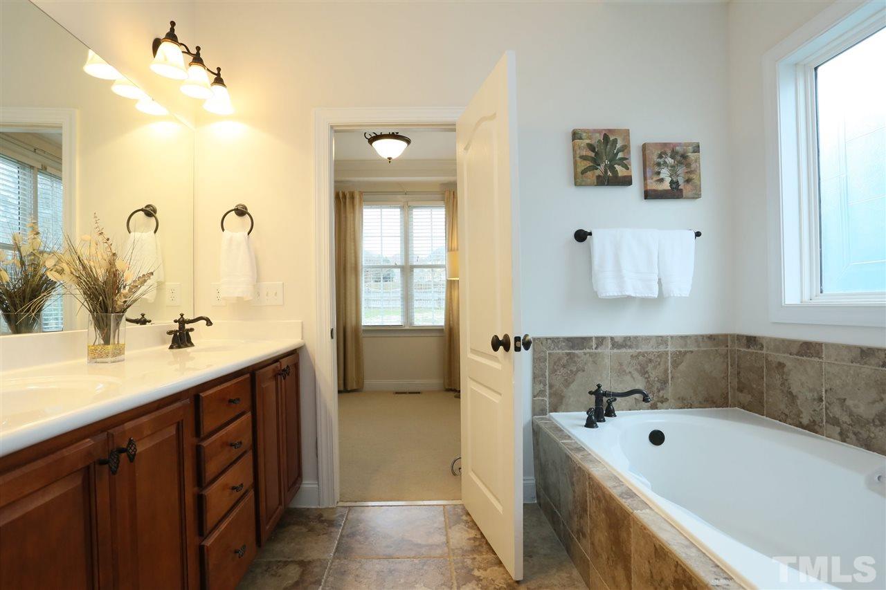 488 May Farm Road Pittsboro, NC 27312 - Photo 14 of 30 Garden tub, double sinks and beautiful tiling