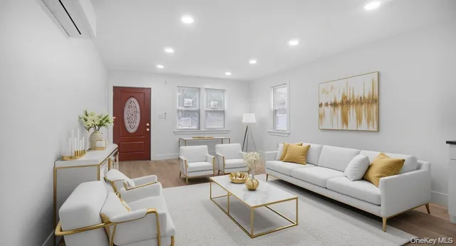 a view of a livingroom with furniture and a window