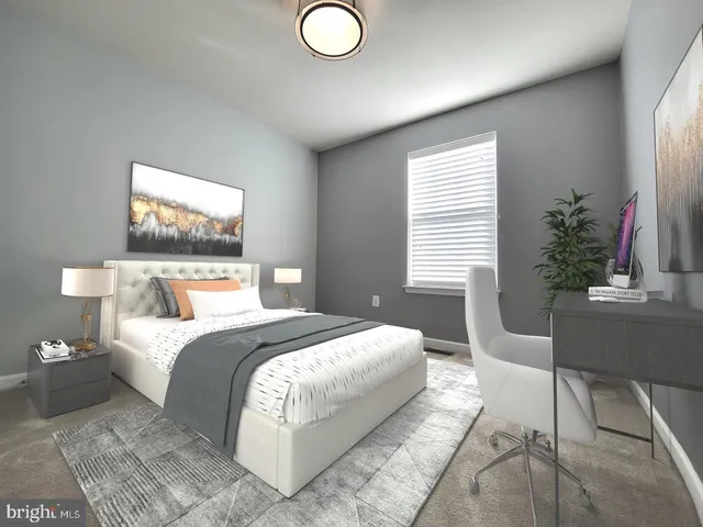 a bedroom with a large bed and a potted plant