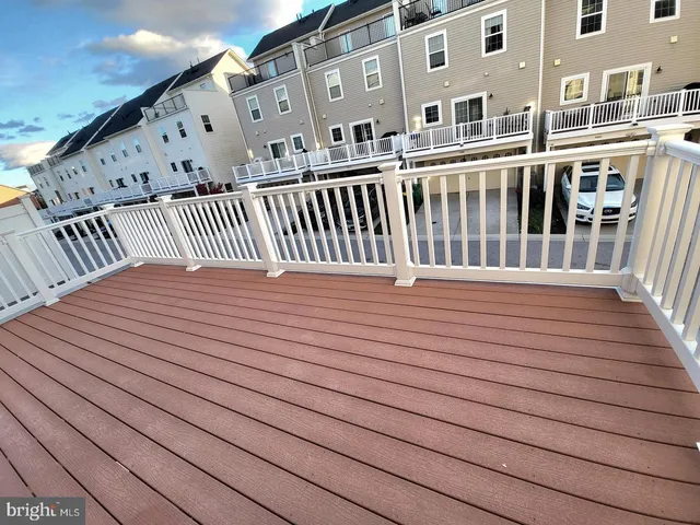 a balcony view with a wooden floor