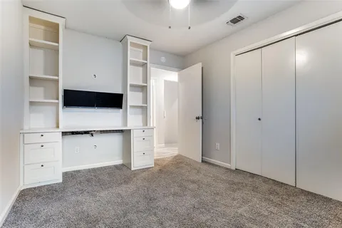 a view of kitchen with white cabinets