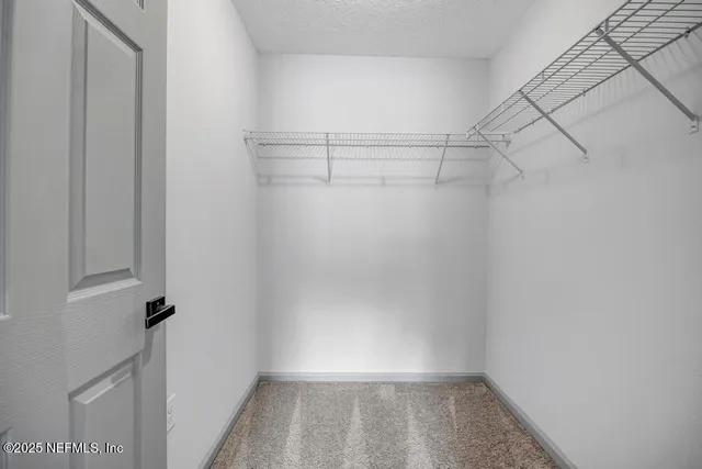 a view of a room with racks on the wall