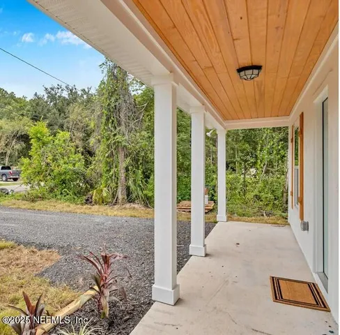 a view of backyard with green space