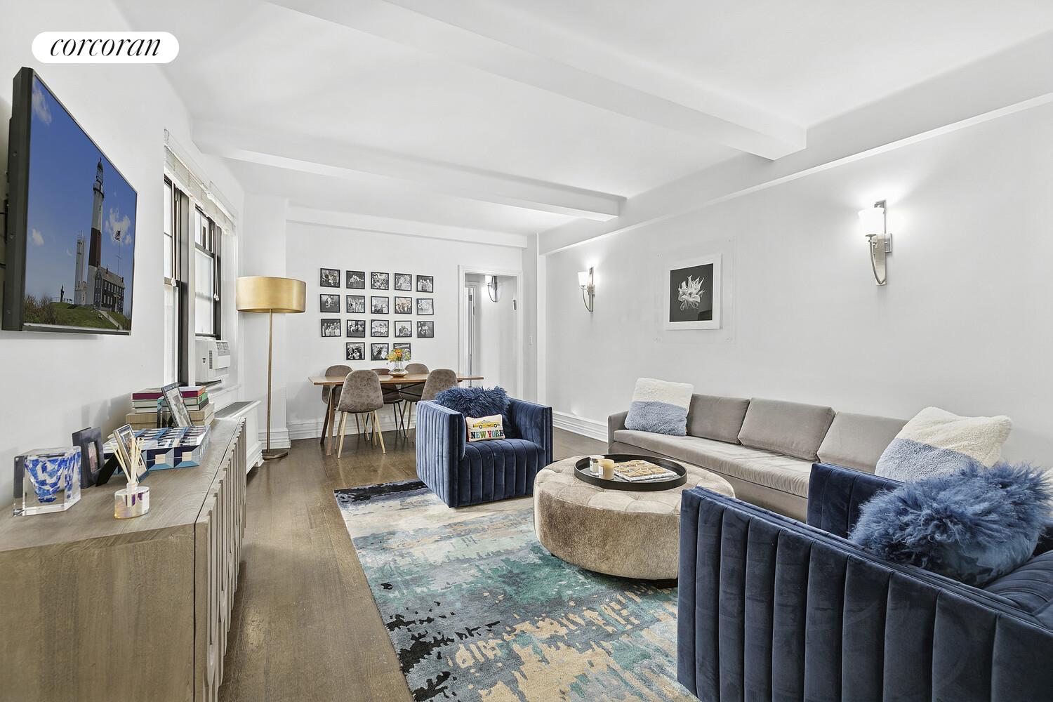 172 West 79th Street, Unit 8E Manhattan, NY 10024 - Photo 1 of 7 a living room with furniture and a window