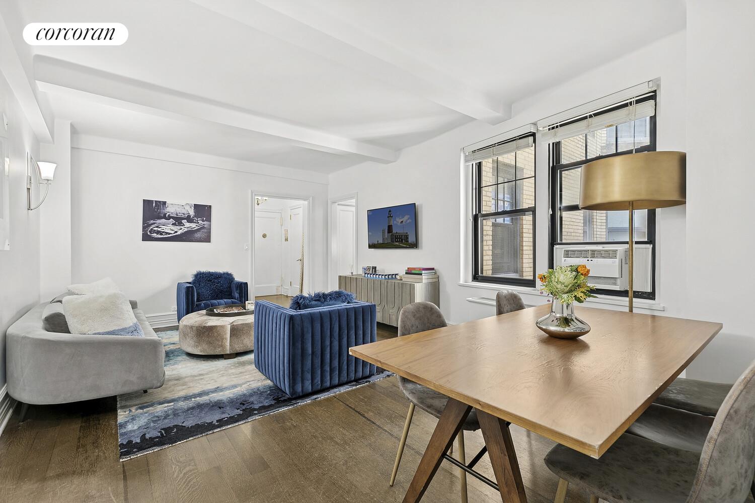 172 West 79th Street, Unit 8E Manhattan, NY 10024 - Photo 2 of 7 a living room with furniture and a flat screen tv