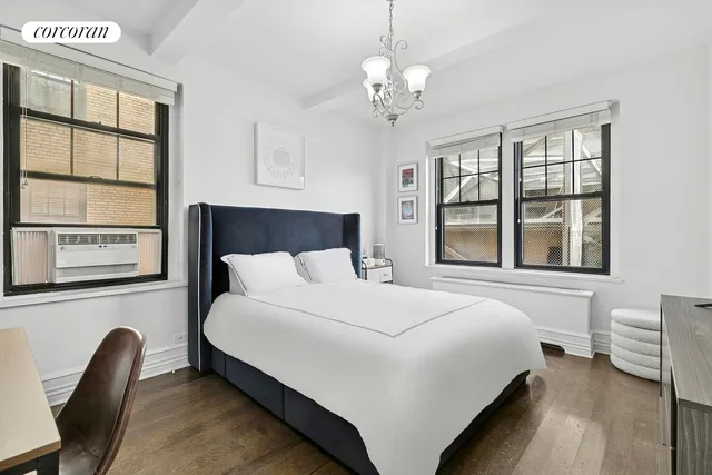 a kitchen with stainless steel appliances granite countertop a stove a sink and a refrigerator with white cabinets