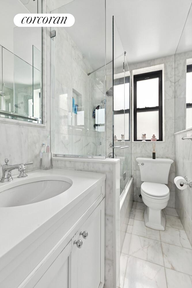 172 West 79th Street, Unit 8E Manhattan, NY 10024 - Photo 5 of 7 a bathroom with a sink a toilet and bathtub