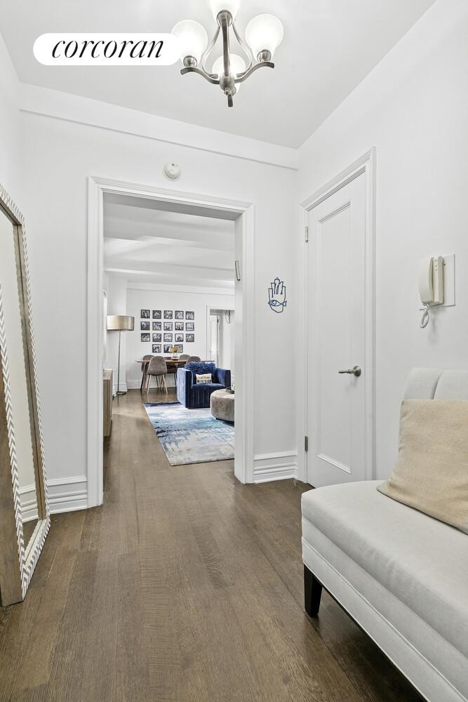 172 West 79th Street, Unit 8E Manhattan, NY 10024 - Photo 6 of 7 a living room with furniture and a window