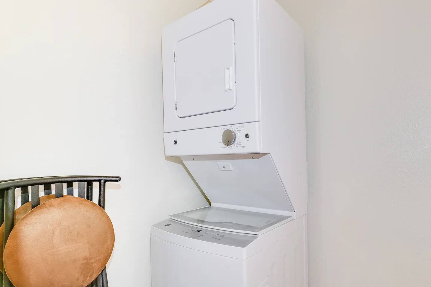 2401 Manor Road, Unit 129 Austin, TX 78722 - Photo 16 of 21 Laundry area with stacked washer and clothes dryer