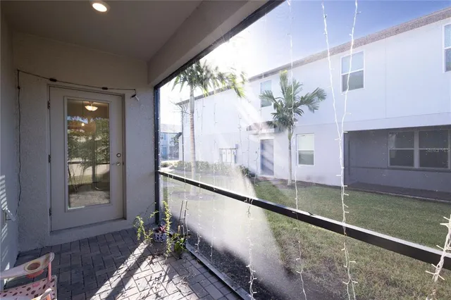 a view of a balcony with chair and table