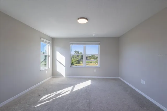 an empty room with windows