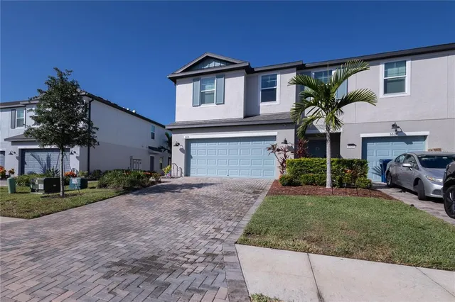 a view of swimming pool with palm trees