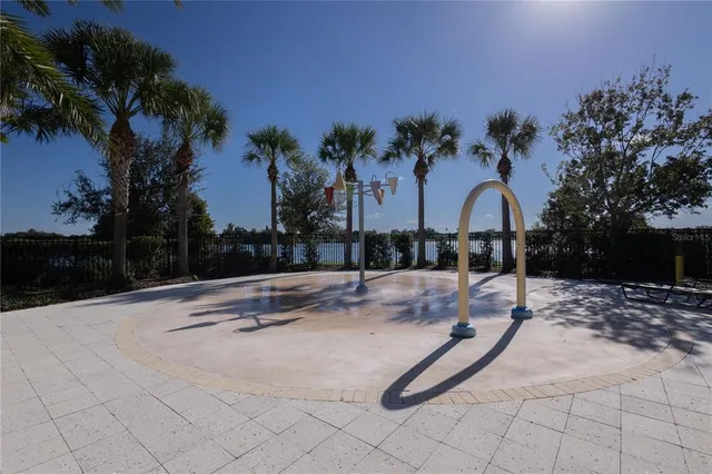 a living room with furniture a flat screen tv and a window