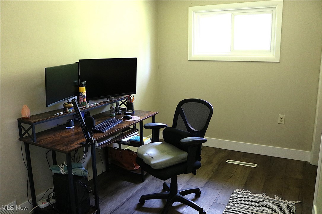 14485 Bass Lake Road Newbury, OH 44065 - Photo 21 of 22 Home office featuring wood finished floors and baseboards