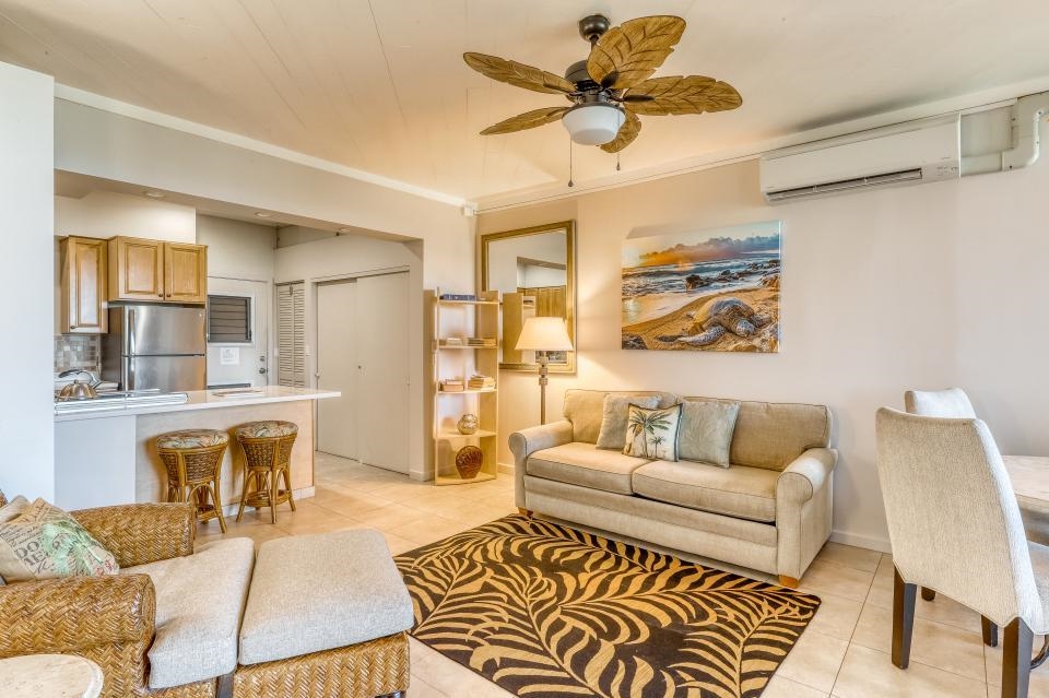 4435 Lower Honoapiilani Road, Unit 204 Lahaina, HI 96761 - Photo 5 of 26 a living room with furniture and a table