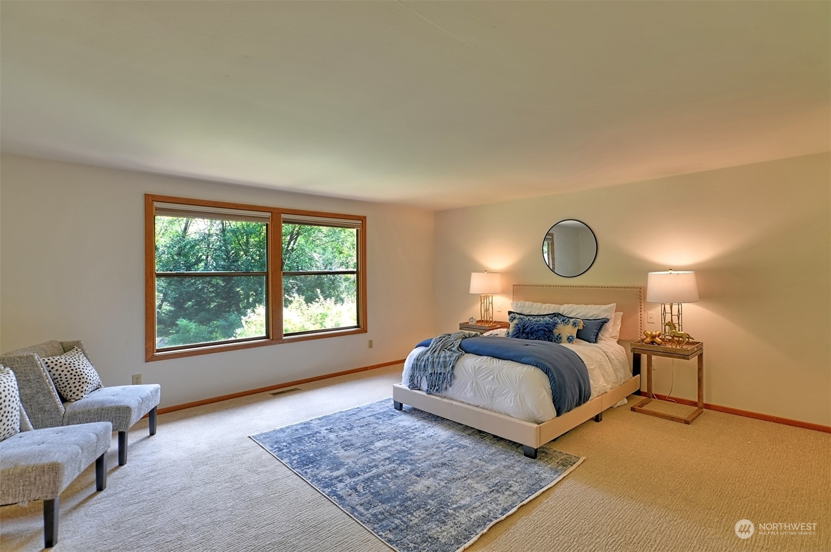 1004 218th Place Southeast Bothell, WA 98021 - Photo 12 of 30 a bed room with a bed lamp and a large window