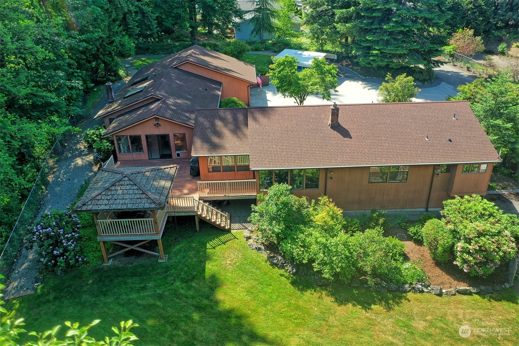 1004 218th Place Southeast Bothell, WA 98021 - Photo 2 of 30 an aerial view of a house with swimming pool and garden