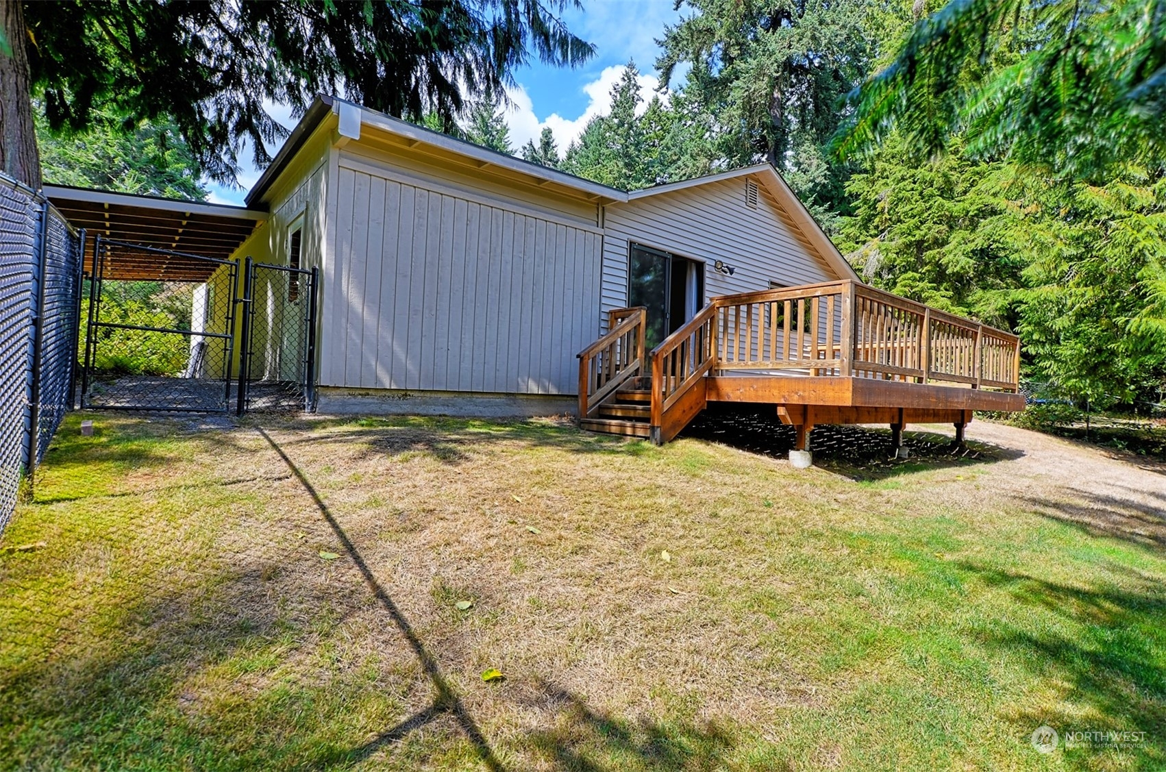 1004 218th Place Southeast Bothell, WA 98021 - Photo 24 of 30 a house with trees in the background