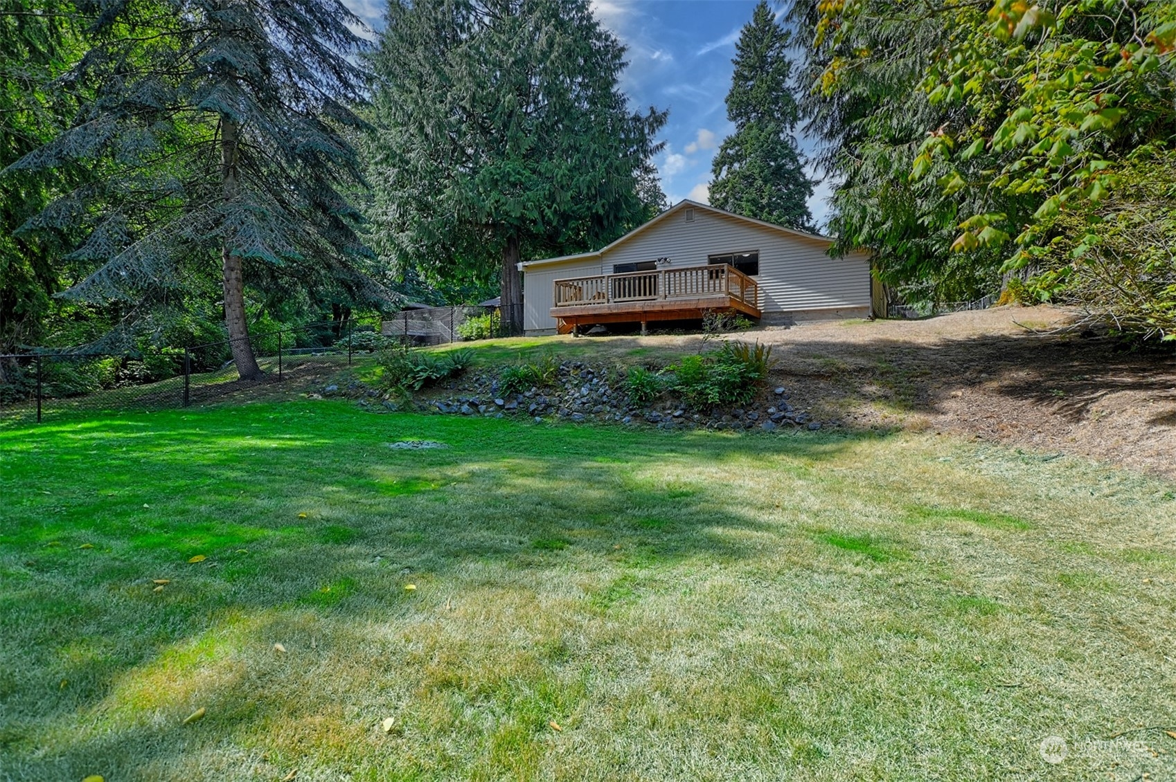1004 218th Place Southeast Bothell, WA 98021 - Photo 26 of 30 a front view of a house with garden