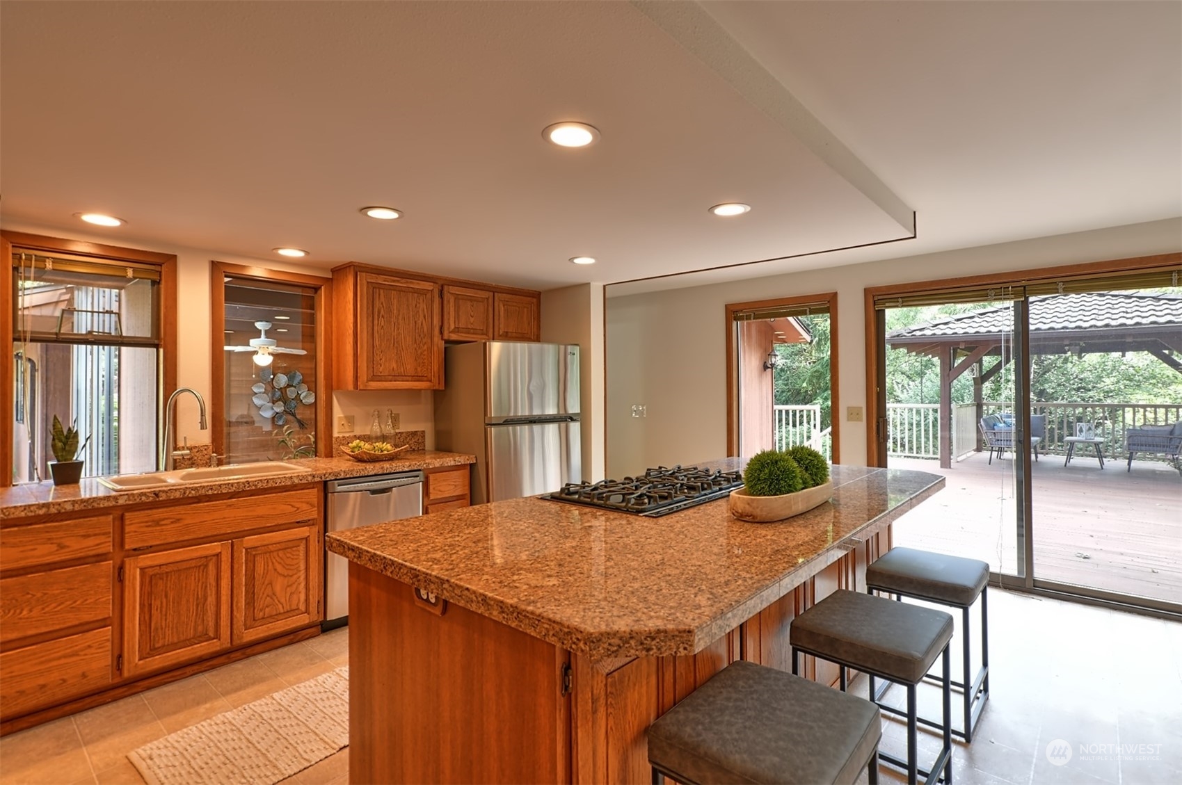 1004 218th Place Southeast Bothell, WA 98021 - Photo 7 of 30 a large kitchen with kitchen island a large window in it