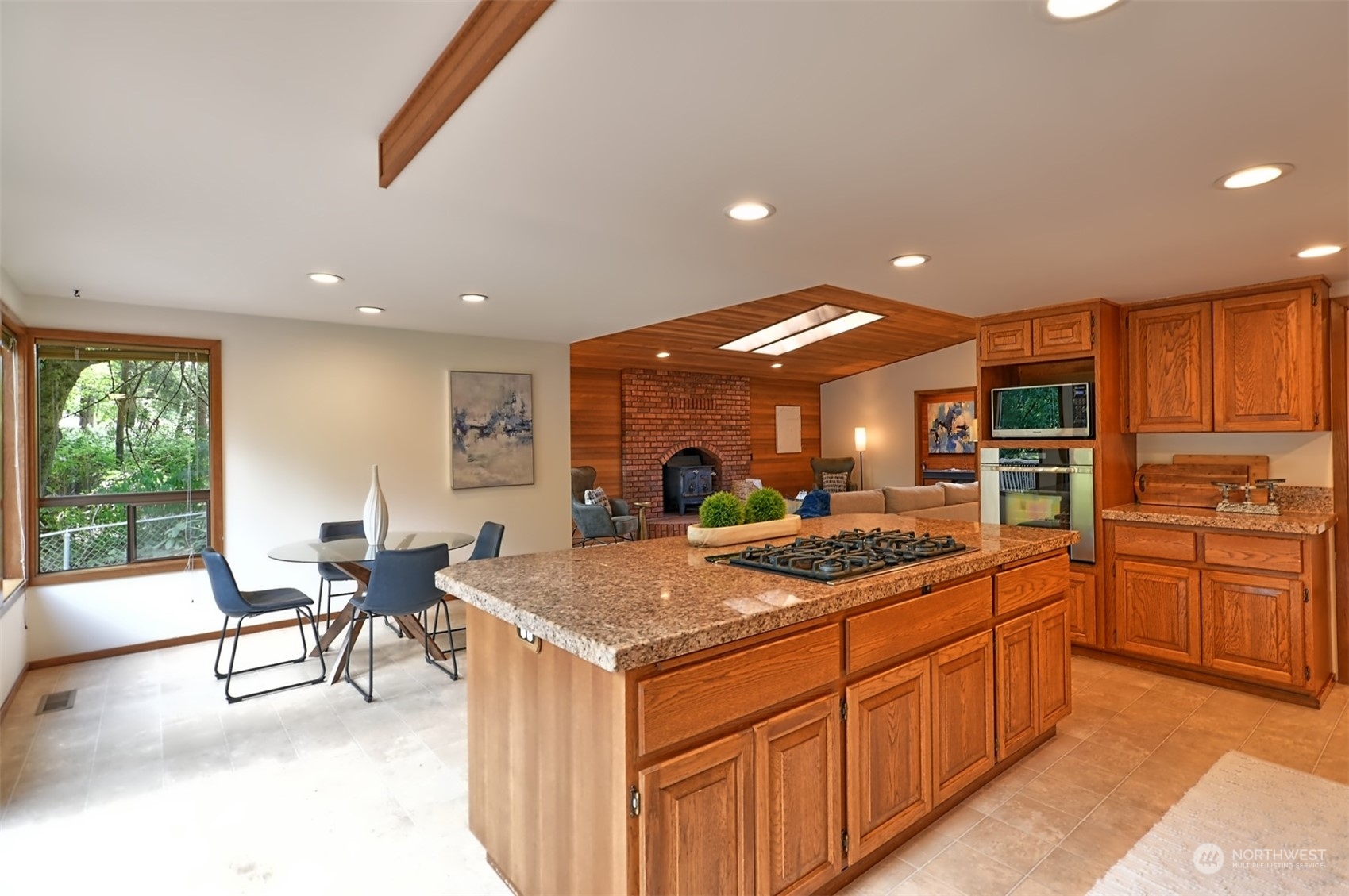 1004 218th Place Southeast Bothell, WA 98021 - Photo 8 of 30 a kitchen with stainless steel appliances granite countertop a sink and cabinets