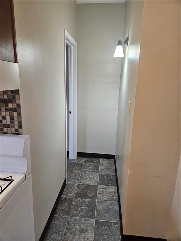 1935 Delaware Avenue, Unit 101 Pittsburgh, PA 15218 - Photo 15 of 20 a view of a hallway with wooden floor and a lamp