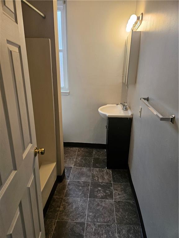 1935 Delaware Avenue, Unit 101 Pittsburgh, PA 15218 - Photo 16 of 20 a bathroom with a sink and mirror