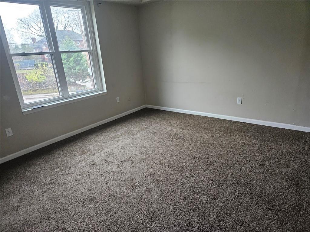 1935 Delaware Avenue, Unit 101 Pittsburgh, PA 15218 - Photo 2 of 20 an empty room with windows