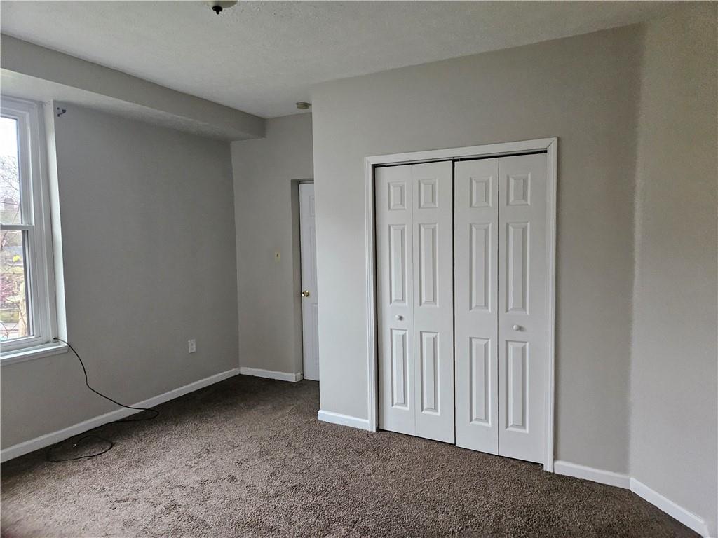 1935 Delaware Avenue, Unit 101 Pittsburgh, PA 15218 - Photo 9 of 20 a view of a livingroom with an empty space and a window