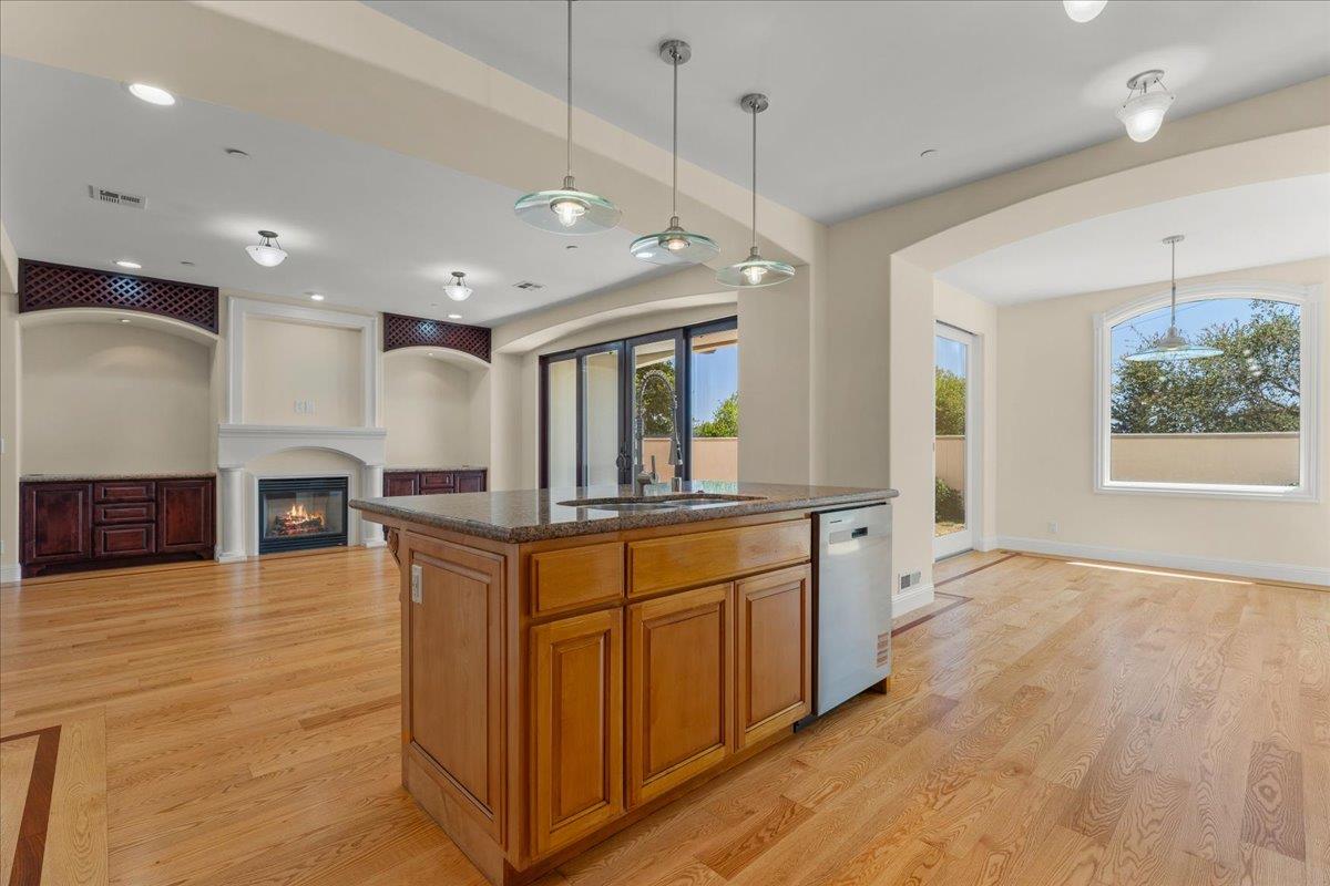 2100 Stone Ridge Drive Watsonville, CA 95076 - Photo 14 of 50 a large kitchen with stainless steel appliances granite countertop a large counter top and a wooden floors