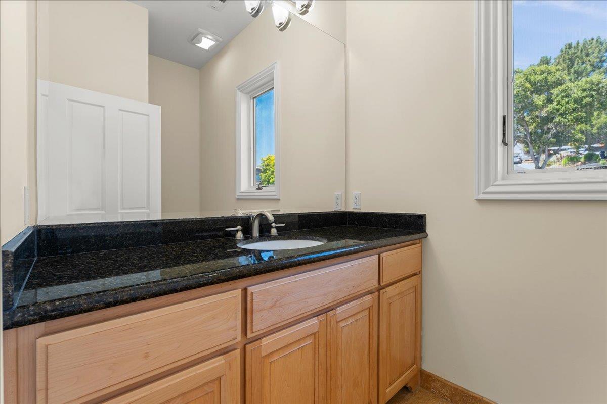 2100 Stone Ridge Drive Watsonville, CA 95076 - Photo 20 of 50 a bathroom with a sink and a mirror