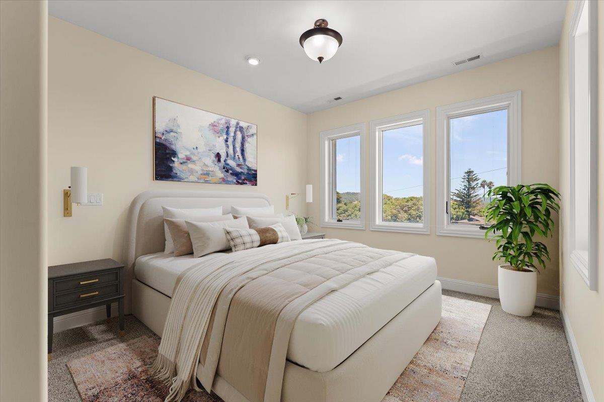 2100 Stone Ridge Drive Watsonville, CA 95076 - Photo 23 of 50 a bedroom with a large bed and a large window