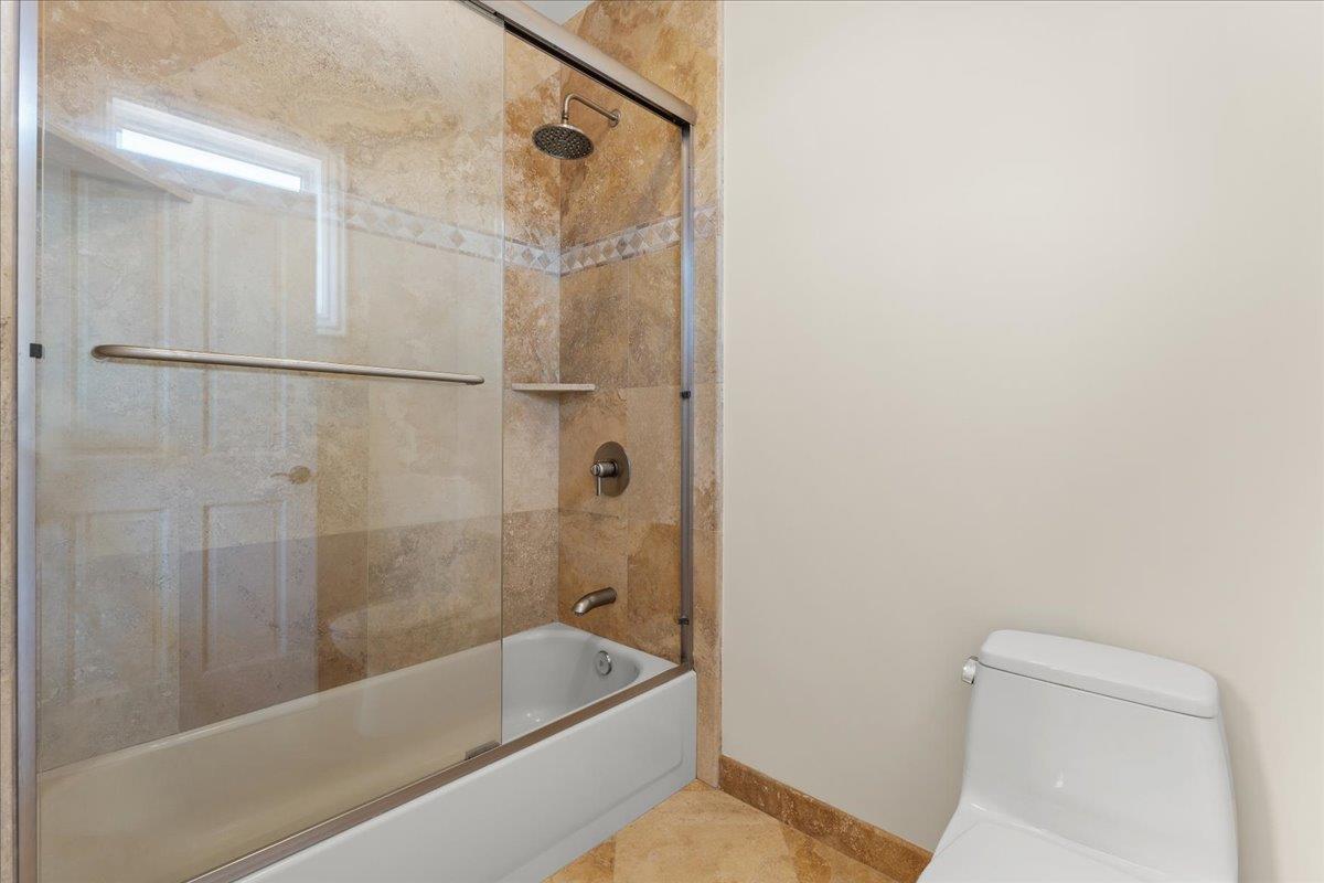 2100 Stone Ridge Drive Watsonville, CA 95076 - Photo 25 of 50 a bathroom with a tub a toilet and a shower