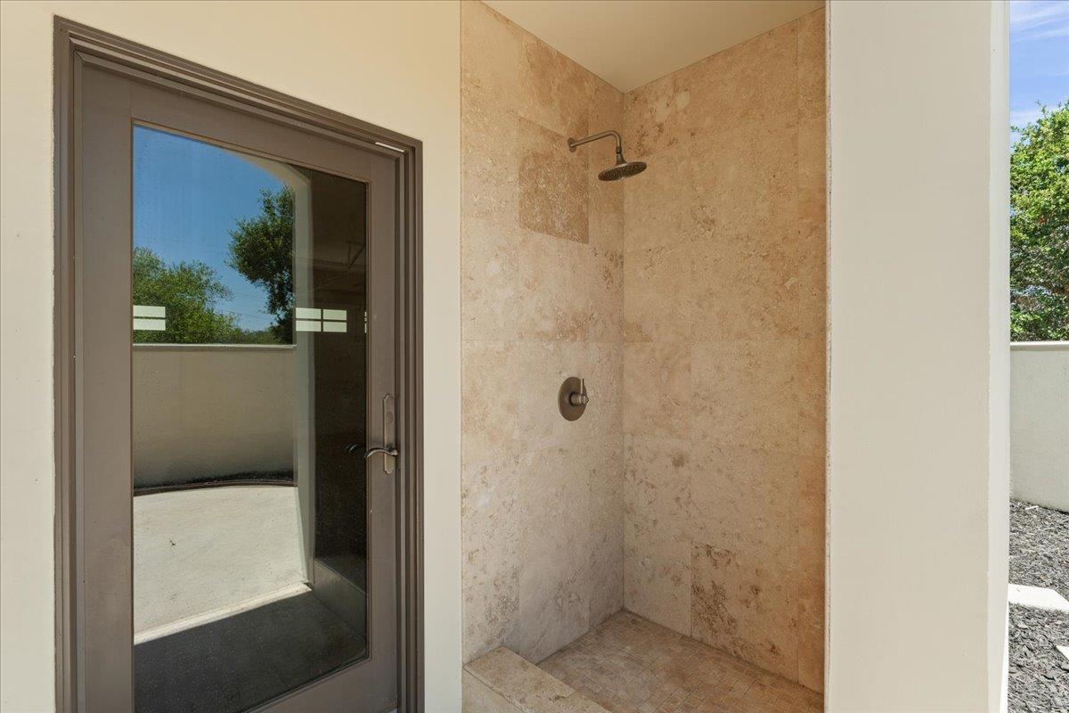 2100 Stone Ridge Drive Watsonville, CA 95076 - Photo 36 of 50 a bathroom with a glass shower door
