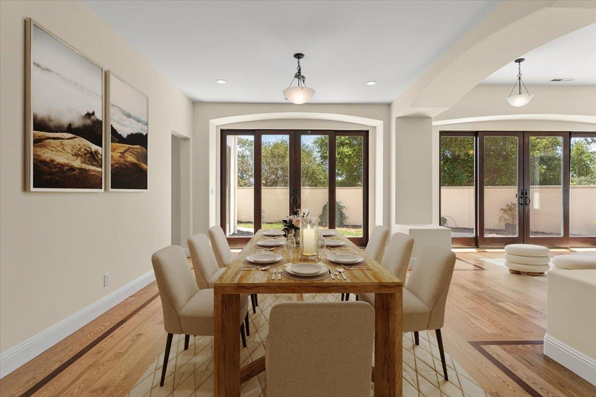 2100 Stone Ridge Drive Watsonville, CA 95076 - Photo 6 of 50 a view of a dining room with furniture large windows and wooden floor