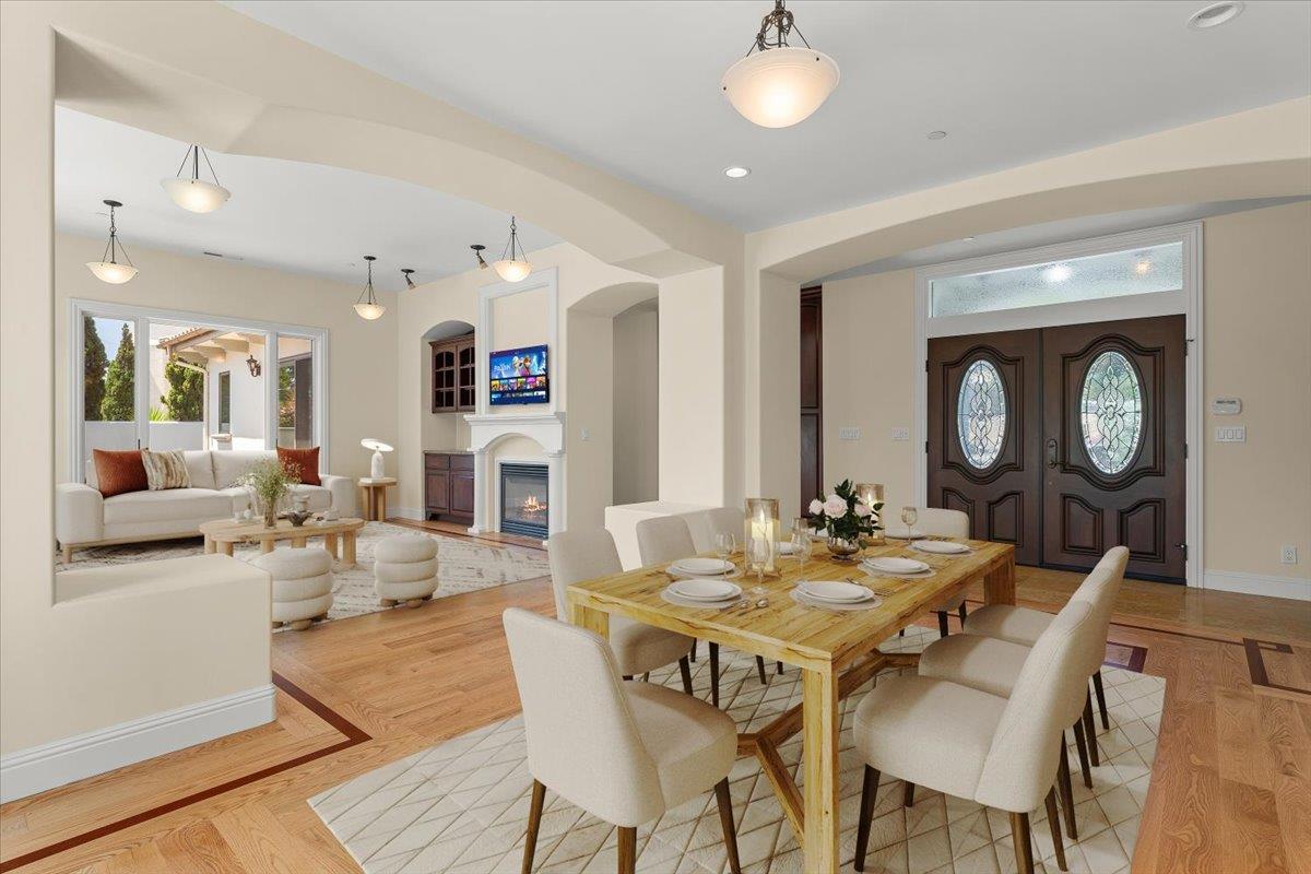 2100 Stone Ridge Drive Watsonville, CA 95076 - Photo 8 of 50 a view of a dining room with furniture and a chandelier