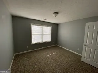 an empty room with a empty space and a window