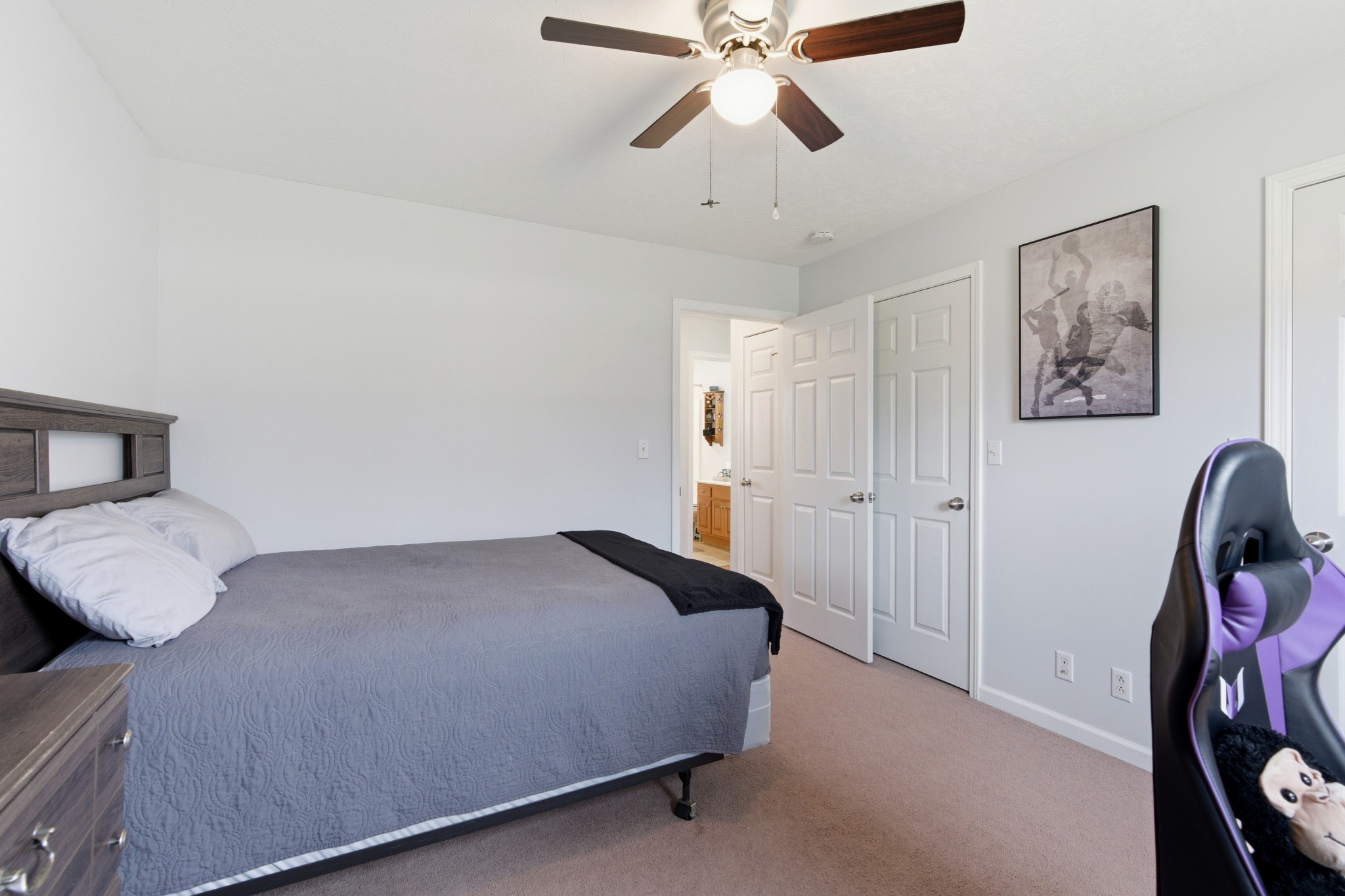3080 Bowker Road Charlotte, TN 37036 - Photo 22 of 31 a bedroom with a bed and painting on the wall