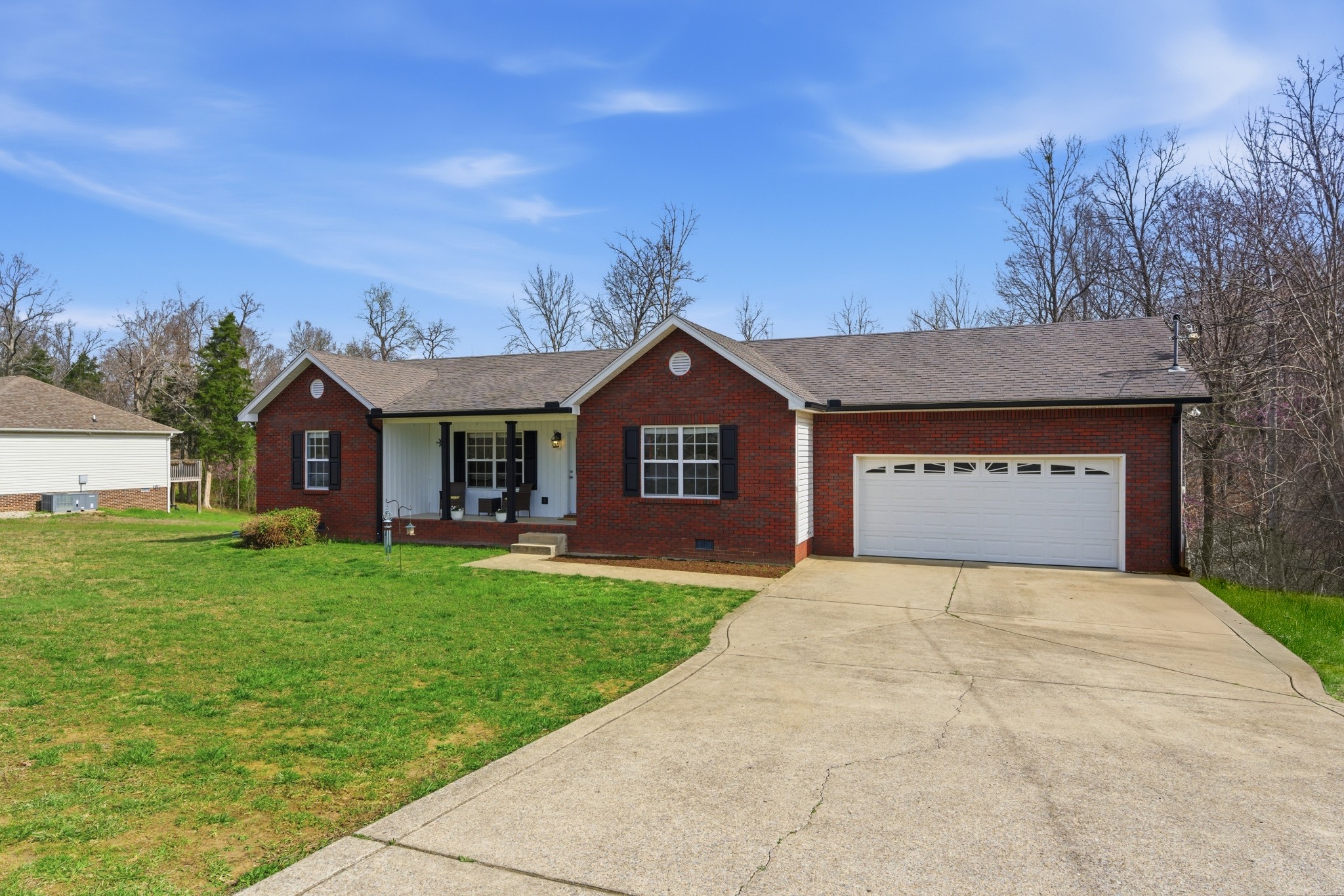 3080 Bowker Road Charlotte, TN 37036 - Photo 29 of 31 a front view of a house with a yard and garage
