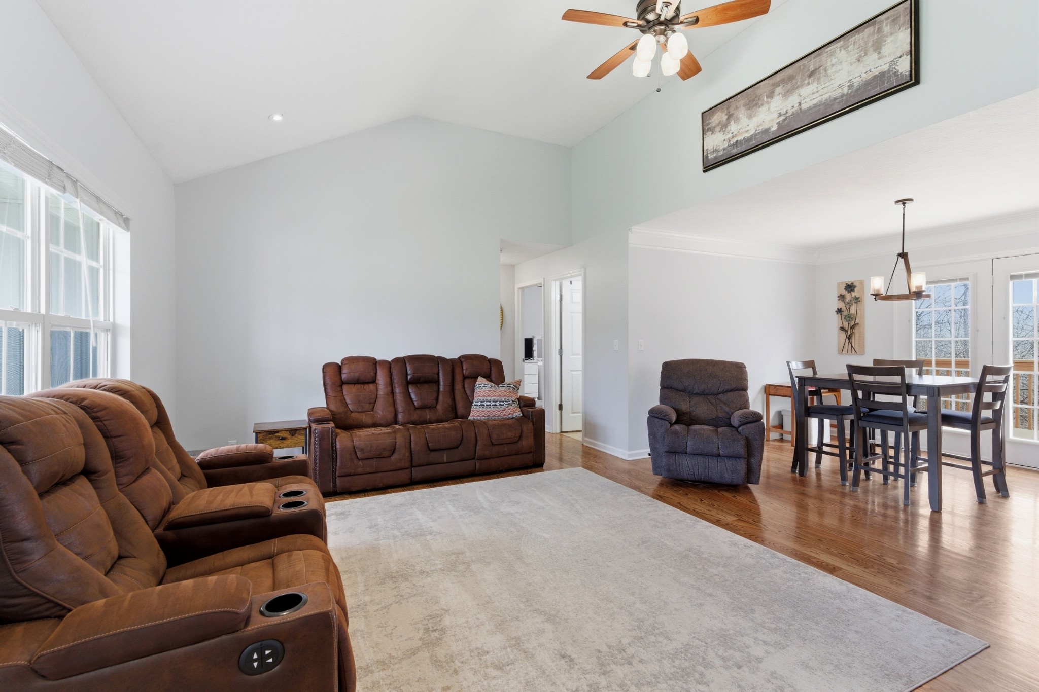 3080 Bowker Road Charlotte, TN 37036 - Photo 8 of 31 a living room with furniture a couch and a chandelier