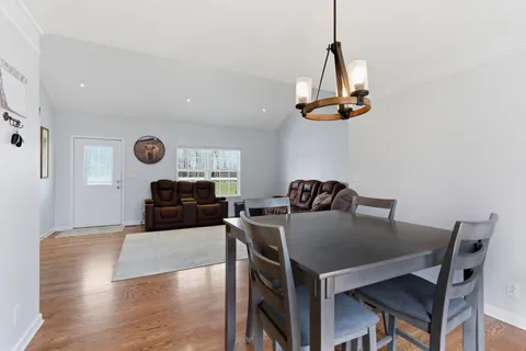 a kitchen with a table and chairs