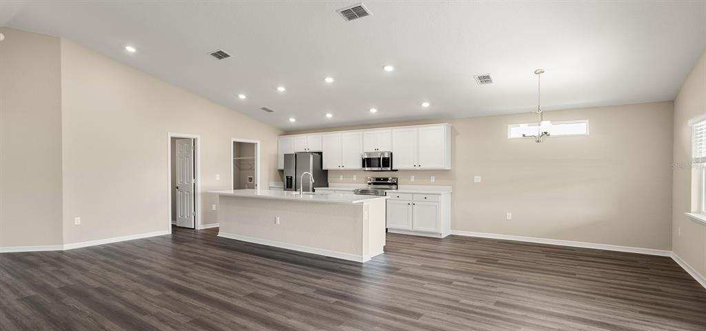 7654 Southwest 6th Loop Ocala, FL 34474 - Photo 11 of 28 a view of kitchen with wooden floor